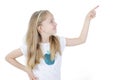 Photo of happy little girl standing. Looking side showing copyspace pointing. Royalty Free Stock Photo