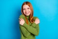 Photo of happy lovely sweet young woman hug herself good mood smile isolated on blue color background Royalty Free Stock Photo