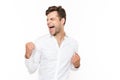 Photo of happy man 30s rejoicing and clenching fists, isolated o Royalty Free Stock Photo