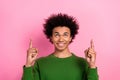 Photo of happy positive guy point finger empty space demonstrate adverts isolated pastel color background