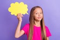 Photo of happy positive smart little girl hold hand cloud thought smile imagine isolated on violet color background