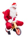 Photo of happy Santa Claus on bike Royalty Free Stock Photo