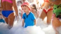 Photo of happy smiling 3 years old little boy dancing and playing with lots of soap foam on the sea beach disco party Royalty Free Stock Photo