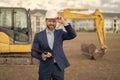 photo of happy supervisor with business project in hardhat. supervisor with business project.