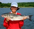 Woman With 10 LB Striped Bass Royalty Free Stock Photo