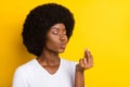 Photo of happy young afro american joyful woman chef kiss delicious tasty isolated on yellow color background