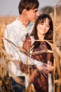 Happy young couple in autumn corn field Royalty Free Stock Photo