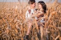 Happy young couple in autumn corn field Royalty Free Stock Photo