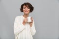 Happy young lady drinking tea. Royalty Free Stock Photo