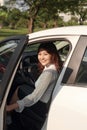 Photo of happy young mixed race woman sitting inside her new car. Concept for car rental Royalty Free Stock Photo