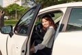 Photo of happy young mixed race woman sitting inside her new car. Concept for car rental Royalty Free Stock Photo