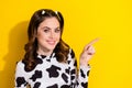 Photo of happy youngster optimistic lady wear cow skin print top direct finger mockup recommend shop isolated on yellow