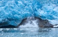 A block of ice falls off and the vertically sloped glacier tongue of Northwestern Glacier (forth of four photos).