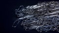 Heap of metal note paper clips on dark background, High details with high contrast