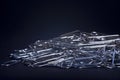 Heap of metal note paper clips on dark background, High details with high contrast Royalty Free Stock Photo