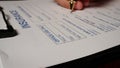 7 photo hispanic male hand filling out writing signature insurance contract form Royalty Free Stock Photo