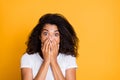 Photo of horrified feared girl in panic negative emotions covering her face after seeing terrible in white t-shirt eyes