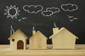 photo of houses and background of blackboard and drawings. real estate and family house concept.