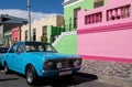 Photo of houses in the Malay Quarter, Bo-Kaap, Cape Town, South Africa with vintage Ford Cortina car outside on street. Royalty Free Stock Photo