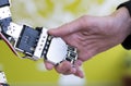 Human hand holding a robot hand with a handshake Royalty Free Stock Photo