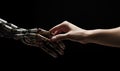 Photo of a human hand holding robotic hand