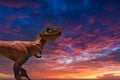 Dinosaur T-Rex with dramatic sky (toy photography) Royalty Free Stock Photo