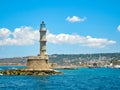 Photo of iconic old Venetian lighthouse in old harbour of Chania. Crete island, Greece - June, 2017