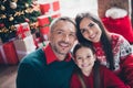 Photo of idyllic family peaceful parents cute small girl enjoy christmastime miracle together apartment inside