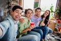 Photo of idyllic positive buddies sitting couch hug drink beer eat pizza make selfie daylight house indoors Royalty Free Stock Photo