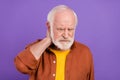 Photo of ill aged man neck hurts wearing brown shirt isolated over purple color background