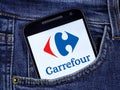 In this photo illustration the Carrefour logo displayed on a smartphone Royalty Free Stock Photo