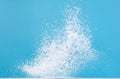 Photo image of explosion dust snow, heavy big small size snows. Freeze shot on blue sky winter background isolated overlay. Fluffy Royalty Free Stock Photo