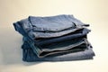 Photo image of a stack of jeans on a white background Royalty Free Stock Photo