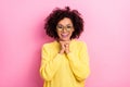 Photo of impressed excited lady wear yellow sweater spectacles arms chin open mouth pink color background