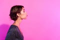 Photo of impressed funky girl dressed glamour clothes blowing air empty space isolated pink color background