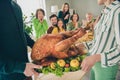 Photo of impressed funny family celebrating thanks giving day sitting ready eat turkey smiling indoors room home