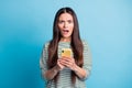 Photo of impressed lady staring open mouth disbelief wear white green isolated on blue color background