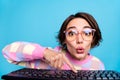 Photo of impressed millennial brunette lady type laptop wear spectacles pink sweater isolated on blue background