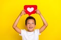 Photo of impressed small boy look heart wear white t-shirt isolated on yellow color background