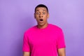 Photo of impressed speechless guy box haircut dressed pink t-shirt staring at unbelievable sale isolated on purple color