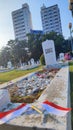 Photo of the Indonesian flag on the graves of heroes as the background on Indonesian Independence Day Portrait