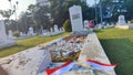 Photo of the Indonesian flag on the graves of heroes as the background on Indonesian Independence Day landscape