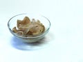 photo of Indonesian traditional food crackers emping in a glass bowl on a white background