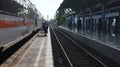 Photo inside the Yogyakarta Tugu Train Station with the train tracks filled with trains, Indonesia