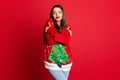 Photo of inspired dreamy lady hands embrace shoulders wear decorated sweater isolated on red color background