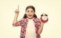 photo of inspired punctual teen girl with alarm clock. punctual teen girl with alarm