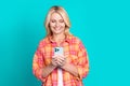 Photo of intelligent nice woman straight hairstyle dressed checkered shirt read email on smartphone isolated on teal