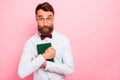 Photo of interested wearing eyeglasses specs weird loony mad of reading hipster having hobby holding green book cover in Royalty Free Stock Photo