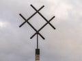 Photo of iron well water symbol in paganism against cloudy sky