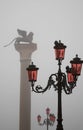 Italy Venice Lion of St. Marks and street lights Royalty Free Stock Photo